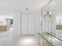 Bright foyer with tiled floor and mirrors, leading to the living areas at 1400 Gulf Blvd # 511, Clearwater Beach, FL 33767