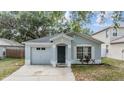 Charming single-Gathering home featuring an attached garage and inviting front entrance at 1524 Marsh Wood Dr, Seffner, FL 33584