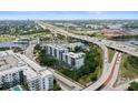 An aerial view of the condominium complex with waterfront access and city skyline at 201 W Laurel St # 307, Tampa, FL 33602