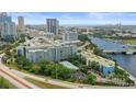 An eye-level aerial view of the condominium complex by the river in a downtown area at 201 W Laurel St # 307, Tampa, FL 33602