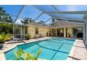 Relaxing screened-in pool area with comfortable seating and well-kept deck at 209 Arlington E Ave, Oldsmar, FL 34677