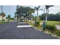 Wide driveway providing ample parking with power and water hookups ready for an RV at 3302 W Shell Point Rd, Ruskin, FL 33570