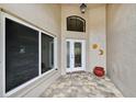 Inviting front porch featuring decorative floor tiles and a beautifully detailed front door, enhancing curb appeal at 336 Northway Dr, Sun City Center, FL 33573
