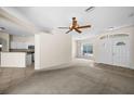 The living room features neutral walls, carpeted floors, a ceiling fan, and an open layout at 4538 Appleton Ter, North Port, FL 34286