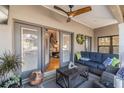 Relaxing covered patio with comfortable seating and access to the interior space at 5010 Umber N Way, Tampa, FL 33624