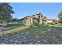 Well-kept single-story house with a spacious front lawn and driveway at 6933 Waterbrook Ct, Gibsonton, FL 33534