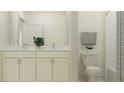 Spacious bathroom featuring a double vanity with marble countertop, a toilet, and a shower at 9328 Gladsome Dr, Land O Lakes, FL 34637
