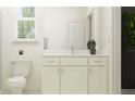Well-lit bathroom featuring a vanity with drawers and a toilet, complemented by a decorative vase at 9328 Gladsome Dr, Land O Lakes, FL 34637
