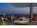 Enjoy breathtaking city views from this spacious balcony with comfortable seating at 1101 E Jackson St, Tampa, FL 33602
