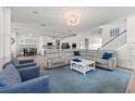 Spacious open concept living room with hardwood floors, modern furniture and natural light at 11854 Lake Lucaya Dr, Riverview, FL 33579
