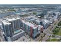 An aerial view highlighting a bustling cityscape with waterfront access and cruise ship terminals at 1208 E Kennedy Blvd # 1125, Tampa, FL 33602