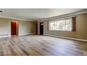 Spacious living area with large window, new flooring, and modern finishes at 1516 Lemon St, Clearwater, FL 33756