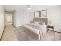Comfortable bedroom featuring neutral tones, closet, and decorative art creating a relaxing retreat at 2070 Sunset Point Rd # 111, Clearwater, FL 33765