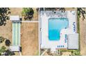 Aerial view showcasing the pool and shuffleboard amenities at this community at 4801 Airport Rd # 214, Zephyrhills, FL 33542