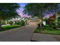 Beautiful home exterior with stone accents, well-maintained lawn, and a spacious driveway at 11862 Frost Aster Dr, Riverview, FL 33579