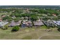 Beautiful home with golf course view, screened-in lanai, and lush surroundings in a serene neighborhood at 13143 Palmilla Cir, Dade City, FL 33525