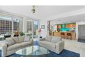 Stylish living room with contemporary decor, city views, and an open layout to the kitchen at 175 1St S St # 1003, St Petersburg, FL 33701