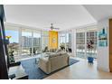 Bright living room featuring large windows with stunning city views and comfortable seating at 175 1St S St # 1003, St Petersburg, FL 33701