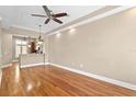 Spacious living room with hardwood floors, recessed lights, and view into kitchen at 2226 Soho Bay Ct, Tampa, FL 33606