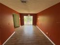 Dining room featuring hardwood floors and a sliding glass door leading to the backyard at 3206 Las Brisas Dr, Riverview, FL 33578