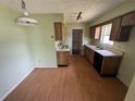 Eat-in kitchen featuring wooden cabinets and black appliances at 3206 Las Brisas Dr, Riverview, FL 33578