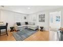 Comfortable living room with a gray sofa, a glass table, and stylish decor at 3611 4Th N Ave, St Petersburg, FL 33713