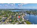 Aerial view of the home in a waterfront community, showcasing its location with access to the bay and city views at 4151 Sunrise S Dr, St Petersburg, FL 33705
