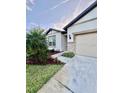 This inviting single-story home features manicured landscaping and a cozy facade at 6293 Bradford Woods Dr, Zephyrhills, FL 33542
