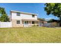 Well-maintained home featuring a spacious lawn, stone accents, and a charming front porch at 8798 94Th St, Seminole, FL 33777
