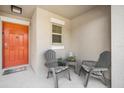 Inviting front porch with comfortable seating, perfect for enjoying quiet moments outdoors at 10229 Bright Crystal Ave, Riverview, FL 33578