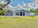 Charming single-story home with a well-manicured lawn and inviting curb appeal at 11268 Shivering Owl Ave, Weeki Wachee, FL 34614