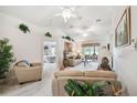 Bright living room with vaulted ceilings, neutral carpet, and comfortable seating at 17425 Eagle Trace Dr, Brooksville, FL 34604