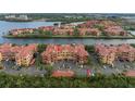 An exterior aerial view of condos with well-maintained landscaping and parking at 2741 Via Cipriani # 931A, Clearwater, FL 33764