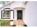 Close up of front door with brick landing and black trim at 538 Summer Sails Dr, Valrico, FL 33594