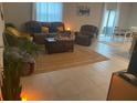 Inviting living room with tile floors, neutral tones, comfortable seating, and plenty of space at 5511 Rainwood Meadows Dr, Apollo Beach, FL 33572
