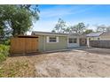 Charming single-story home with a unique exterior and a spacious front yard at 817 E 145Th Ave, Tampa, FL 33613