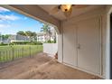 Enclosed outdoor patio with a ceiling fan and additional storage at 8765 Bardmoor Blvd # 107, Seminole, FL 33777
