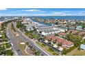 Community aerial view showcasing the residences, landscaping, and proximity to the water at 903 Pinellas Bayway S # 308, Tierra Verde, FL 33715