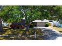 Charming home with mature trees in the front yard providing ample shade at 10035 82Nd St, Seminole, FL 33777