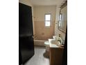 Bathroom features a tub with tile surround and a single sink vanity at 1125 Engman St, Clearwater, FL 33755