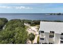 Waterfront condo positioned near tranquil bay with thriving green vegetation at 1500 Sunset Rd # C7, Tarpon Springs, FL 34689