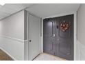 Double door entry with decorative wreath and tile floors at 220 Belleview Blvd # 104, Belleair, FL 33756