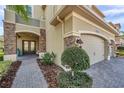 A welcoming front entrance with stone accents and covered porch at 2495 Oakwood Preserve Dr, Wesley Chapel, FL 33543