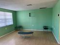 Spacious living room with light wood floors and plenty of natural light at 3330 Monticello St, Holiday, FL 34690