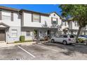 Inviting two-story townhouse featuring neutral siding, manicured landscaping, and convenient parking at 4332 Har Paul Cir, Tampa, FL 33614