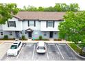 Aerial view of townhomes with designated parking spaces and manicured landscaping at 4332 Har Paul Cir, Tampa, FL 33614