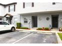 Townhouse exterior featuring modern design elements, tidy landscaping, and convenient parking at 4332 Har Paul Cir, Tampa, FL 33614