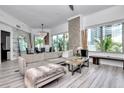Spacious open-concept living area features modern decor, comfortable seating, and access to an outdoor balcony at 449 S 12Th St # 504, Tampa, FL 33602