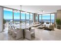 Open-concept living room with floor-to-ceiling windows and contemporary furnishings at 520 N Tampa St # 2303, Tampa, FL 33602