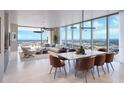Elegant living and dining area with floor-to-ceiling windows offering panoramic city views at 520 N Tampa St # 3001, Tampa, FL 33602